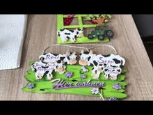 Laden und Abspielen von Videos im Galerie-Viewer, Kuh aus Holz als Leibgarde für Kantholz