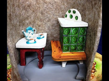 Laden und Abspielen von Videos im Galerie-Viewer, Kachelofen Tisch und Fahrrad aus Holz