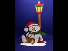 Laden und Abspielen von Videos im Galerie-Viewer, Schneemann sitzend mit dickem Bauch und Laterne